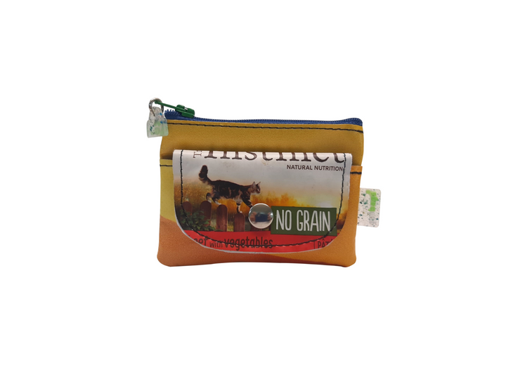 pop purse cat food package cat on the fence