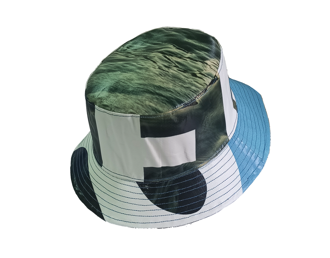 Bucket Hat publicity banner black and white & green leaves