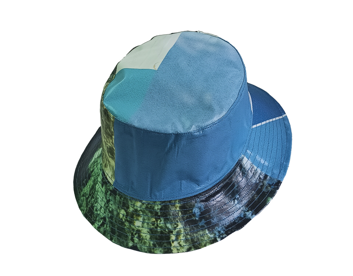 Bucket Hat publicity banner blue and green leaves